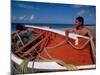 Fisherman Tends His Boat on the Beach, Isla Margarita, Venezuela-Greg Johnston-Mounted Photographic Print