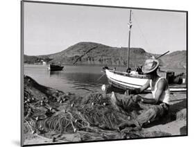 Fisherman Tends to His Nets in Greece-null-Mounted Photographic Print
