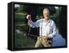 Fisherman with Bass-null-Framed Stretched Canvas