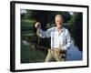 Fisherman with Bass-null-Framed Photographic Print