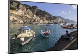 Fisherman Working on Harbour Quayside with View Towards Amalfi Town and Fishing Boats-Eleanor Scriven-Mounted Photographic Print