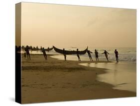 Fishermen Hauling in Nets at Sunrise, Chowara Beach, Near Kovalam, Kerala, India, Asia-Stuart Black-Stretched Canvas