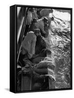 Fishermen Hauling Net onto Boat-Ralph Morse-Framed Stretched Canvas