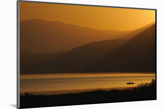 Fishermen in Boat on Lake Prespa, Silhouetted at Sunrise, Lake Prespa National Park, Albania, June-Geidemark-Mounted Photographic Print
