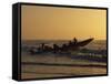 Fishermen Launch their Boat into the Atlantic Ocean at Sunset-Amar Grover-Framed Stretched Canvas