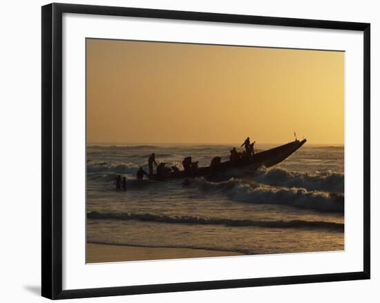 Fishermen Launch their Boat into the Atlantic Ocean at Sunset-Amar Grover-Framed Photographic Print