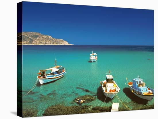 Fishiing Boats and Man Snorkelling at Anopi Beach, Karpathos, Dodecanese, Greek Islands, Greece-Sakis Papadopoulos-Stretched Canvas