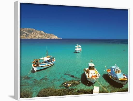 Fishiing Boats and Man Snorkelling at Anopi Beach, Karpathos, Dodecanese, Greek Islands, Greece-Sakis Papadopoulos-Framed Photographic Print