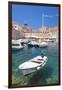 Fishing boat and clear water in the Old Port, Dubrovnik Old Town, Dubrovnik, Dalmatian Coast, Croat-Neale Clark-Framed Premium Photographic Print