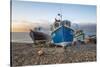 Fishing boats pulled up on shingle beach at sunrise, Beer, Jurassic Coast, Devon, England-Stuart Black-Stretched Canvas