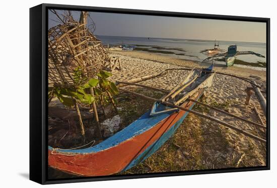 Fishing boats pulled up onto Paliton beach, Siquijor, Philippines, Southeast Asia, Asia-Nigel Hicks-Framed Stretched Canvas