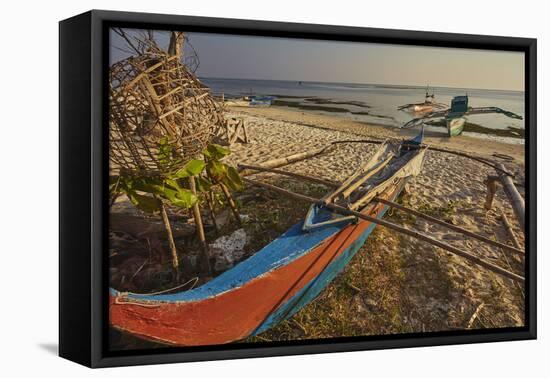 Fishing boats pulled up onto Paliton beach, Siquijor, Philippines, Southeast Asia, Asia-Nigel Hicks-Framed Stretched Canvas