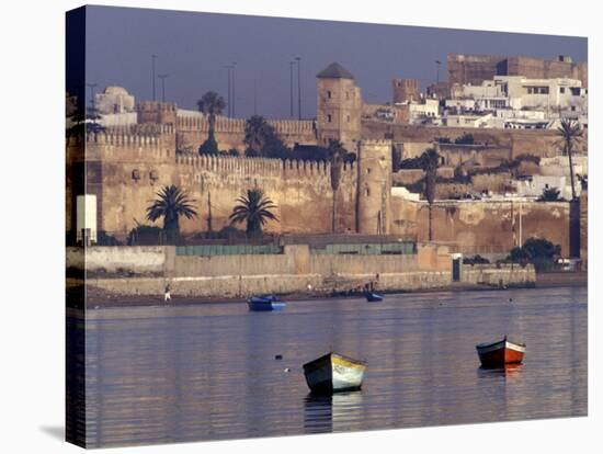 Fishing Boats with 17th century Kasbah des Oudaias, Morocco-Merrill Images-Stretched Canvas