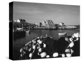 Fishing Nets and Houses at Harbor, Peggy's Cove, Nova Scotia, Canada-Greg Probst-Stretched Canvas