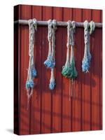 Fishing Nets Hanging from Rorbuer Exterior, Storvagen, Austvagsoya, Lofoten, Nordland, Norway-Doug Pearson-Stretched Canvas