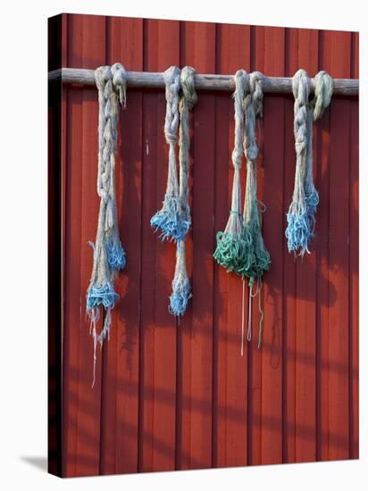 Fishing Nets Hanging from Rorbuer Exterior, Storvagen, Austvagsoya, Lofoten, Nordland, Norway-Doug Pearson-Stretched Canvas