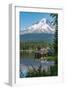 Fishing on Trillium Lake with Mount Hood, part of the Cascade Range, reflected in the still waters,-Martin Child-Framed Photographic Print