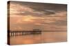 Fishing pier off Safety Harbor, Florida at sunset with people fishing, deep pink sunset sky-Sheila Haddad-Stretched Canvas