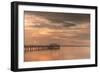 Fishing pier off Safety Harbor, Florida at sunset with people fishing, deep pink sunset sky-Sheila Haddad-Framed Photographic Print