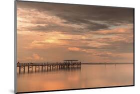 Fishing pier off Safety Harbor, Florida at sunset with people fishing, deep pink sunset sky-Sheila Haddad-Mounted Photographic Print