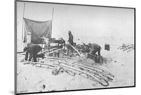 'Fitting the Hand-Sledges with Runners. July, 1895', (1897)-Unknown-Mounted Photographic Print