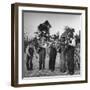 Five Male Musicians Dressed in Hats and Bib Overalls Standing in a Field-Eric Schaal-Framed Photographic Print