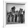 Five Male Musicians Dressed in Hats and Bib Overalls Standing in a Field-Eric Schaal-Framed Photographic Print