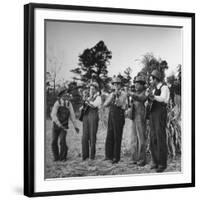 Five Male Musicians Dressed in Hats and Bib Overalls Standing in a Field-Eric Schaal-Framed Photographic Print