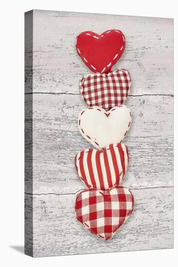 Five Red and White Fabric Hearts-Cora Niele-Stretched Canvas