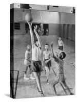 Five Young Boys Wearing Gym Clothes and Playing a Game of Basketball in the School Gym-null-Stretched Canvas