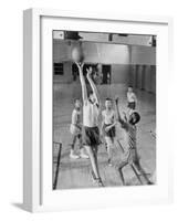 Five Young Boys Wearing Gym Clothes and Playing a Game of Basketball in the School Gym-null-Framed Photographic Print