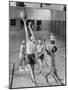 Five Young Boys Wearing Gym Clothes and Playing a Game of Basketball in the School Gym-null-Mounted Photographic Print