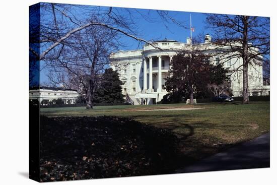 Flag Flying at Half-Staff outside White House-null-Stretched Canvas