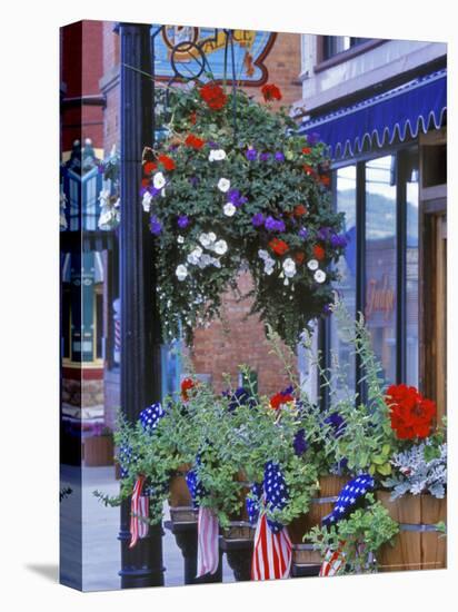 Flags and Flowers, Philipsburg, Montana, USA-Chuck Haney-Stretched Canvas