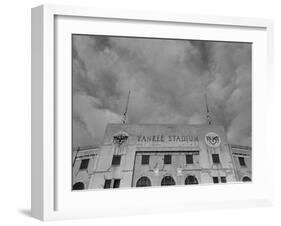 Flags Flying at Half Mast on Top of Yankee Stadium to Honor Late Baseball Player Babe Ruth-Cornell Capa-Framed Photographic Print