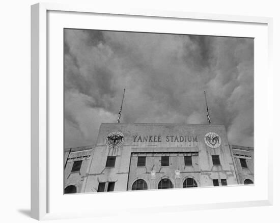 Flags Flying at Half Mast on Top of Yankee Stadium to Honor Late Baseball Player Babe Ruth-Cornell Capa-Framed Photographic Print