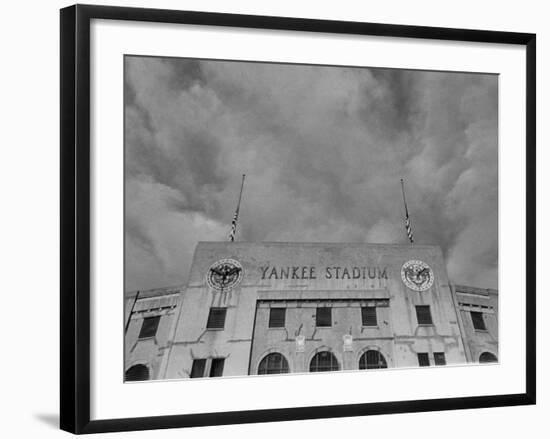 Flags Flying at Half Mast on Top of Yankee Stadium to Honor Late Baseball Player Babe Ruth-Cornell Capa-Framed Photographic Print