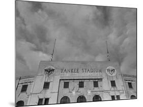 Flags Flying at Half Mast on Top of Yankee Stadium to Honor Late Baseball Player Babe Ruth-Cornell Capa-Mounted Photographic Print