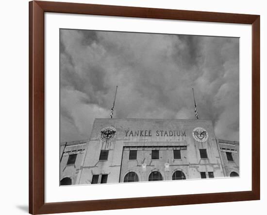 Flags Flying at Half Mast on Top of Yankee Stadium to Honor Late Baseball Player Babe Ruth-Cornell Capa-Framed Photographic Print