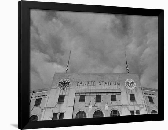 Flags Flying at Half Mast on Top of Yankee Stadium to Honor Late Baseball Player Babe Ruth-Cornell Capa-Framed Photographic Print