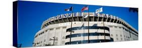 Flags in Front of a Stadium, Yankee Stadium, New York City, New York, USA-null-Stretched Canvas