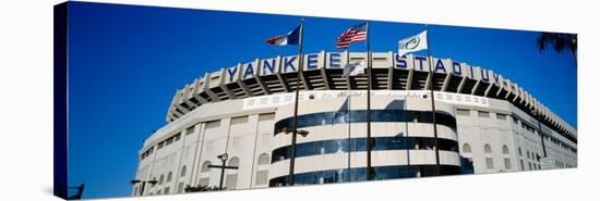 Flags in Front of a Stadium, Yankee Stadium, New York City, New York, USA-null-Stretched Canvas