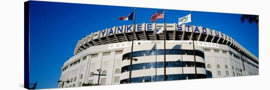 Flags in Front of a Stadium, Yankee Stadium, New York City, New York, USA-null-Stretched Canvas