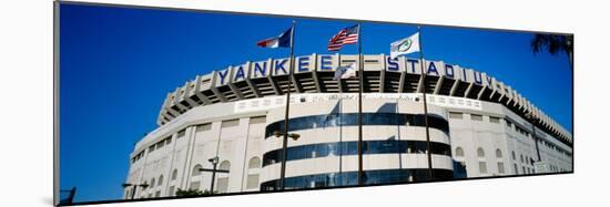 Flags in Front of a Stadium, Yankee Stadium, New York City, New York, USA-null-Mounted Photographic Print