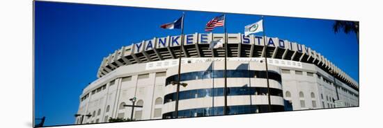 Flags in Front of a Stadium, Yankee Stadium, New York City, New York, USA-null-Mounted Photographic Print