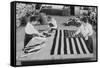 Flags Laid Out on Cutting Table to Be Sewn by Seamstresses During the Period of the Great War-null-Framed Stretched Canvas