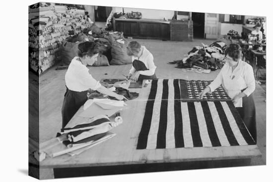 Flags Laid Out on Cutting Table to Be Sewn by Seamstresses During the Period of the Great War-null-Stretched Canvas