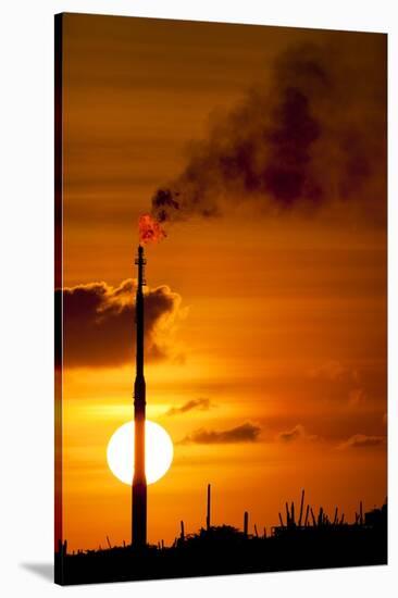 Flames and Smoke Billow from Natural Gas Flare at Valero Oil Refinery at Sunset-null-Stretched Canvas