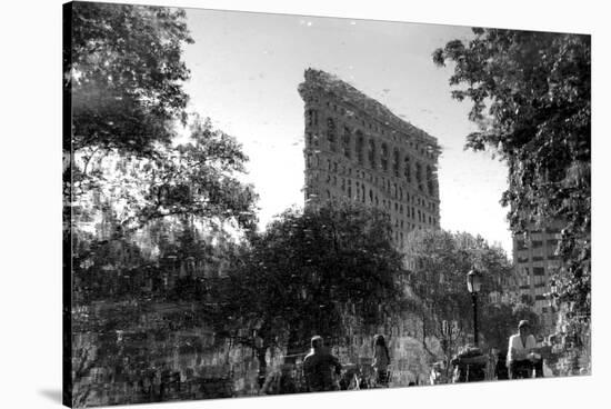 Flatiron Building in NYC Through Reflection in Fountain in Madison Sq. Park-null-Stretched Canvas