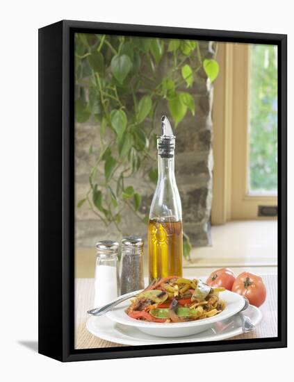 Flavored Oil and Salt and Pepper Shakers Beside Bowl of Pasta-null-Framed Stretched Canvas